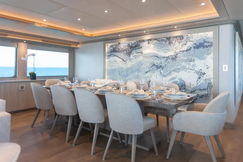 Slide: The Image of Luxurious dining area on 2000 Trinity Yachts Trinity 160, featuring elegant decor and ocean views. - 17