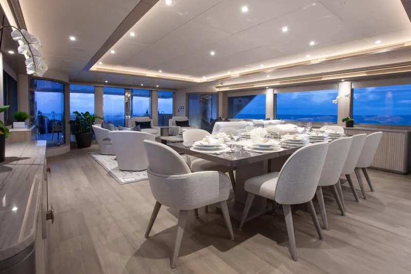 Slide: The Image of Luxurious dining area on 2000 Trinity Yachts Trinity 160, featuring elegant decor and ocean views. - 18