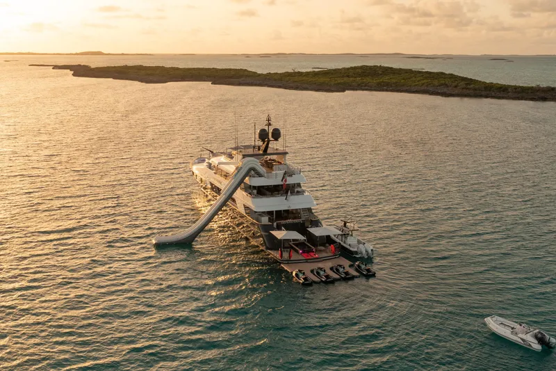 Slide: The Image of Luxurious 2000 Trinity Yachts Trinity 160 with slide, anchored at sunset. - 2