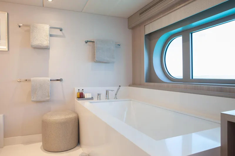 Slide: The Image of Luxurious bathroom on 2000 Trinity Yachts Trinity 160, featuring a modern bathtub and ocean view. - 23