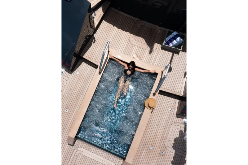 Slide: The Image of Person relaxing in a pool on a 2000 Trinity Yachts Trinity 160. - 3