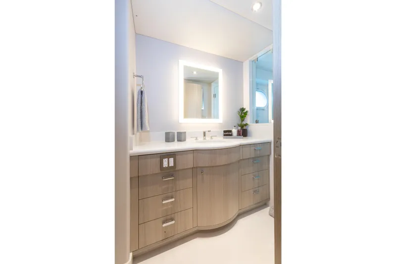 Slide: The Image of Luxurious yacht bathroom with modern vanity, mirror, and elegant lighting on Trinity 160. - 32
