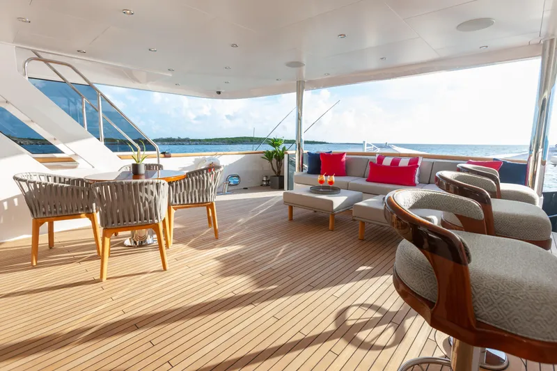Slide: The Image of Luxurious deck of 2000 Trinity Yachts Trinity 160, featuring elegant seating and ocean view. - 37