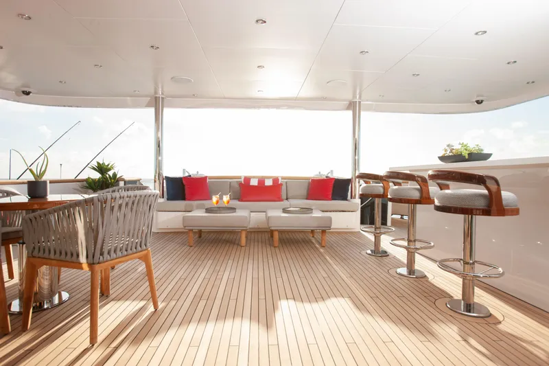 Slide: The Image of Luxurious deck of 2000 Trinity Yachts Trinity 160 with elegant seating and bar stools. - 38