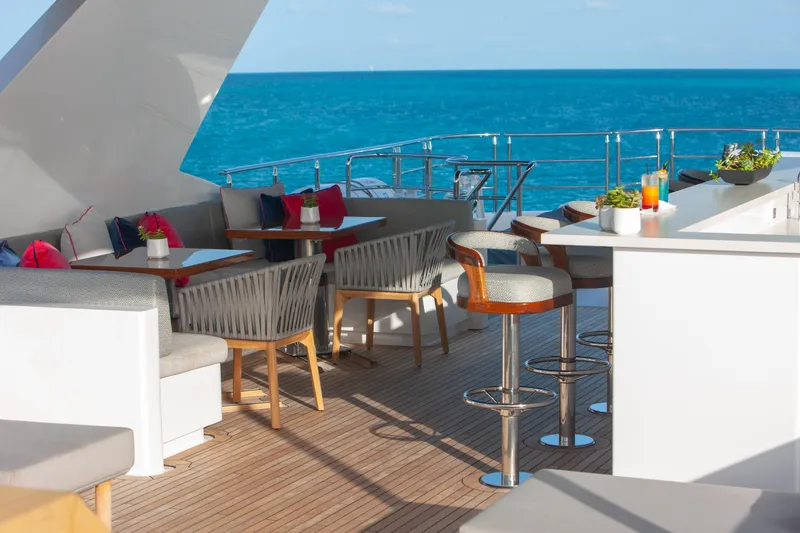 Slide: The Image of Luxurious deck of 2000 Trinity Yachts Trinity 160 with ocean view and elegant seating. - 44