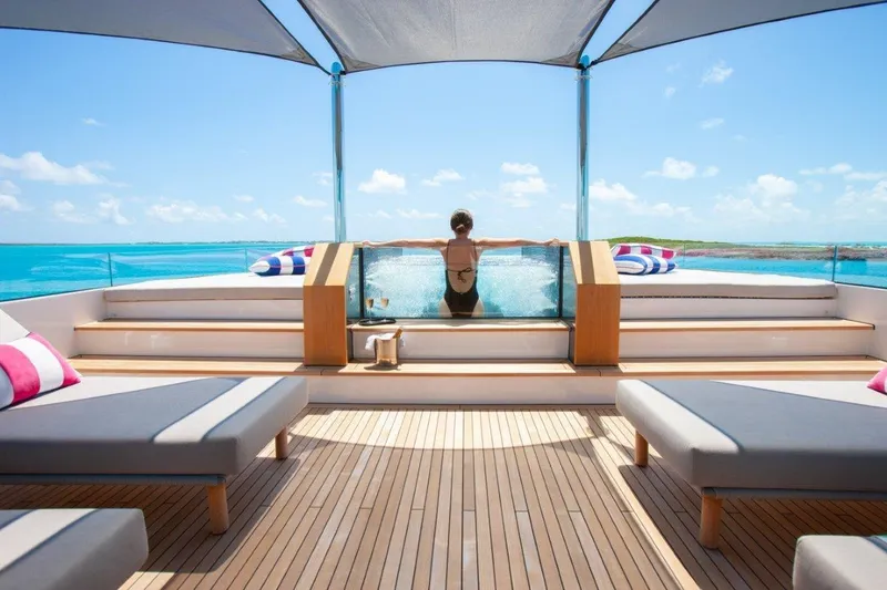 Slide: The Image of Luxurious Trinity Yachts 160 deck with sun loungers and ocean view, 2000 model. - 45