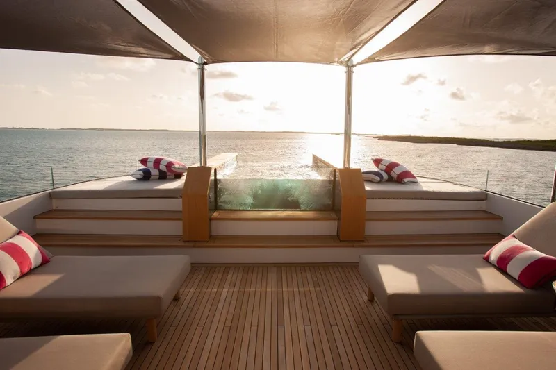 Slide: The Image of Luxurious deck of 2000 Trinity Yachts Trinity 160 with sun loungers and ocean view. - 46