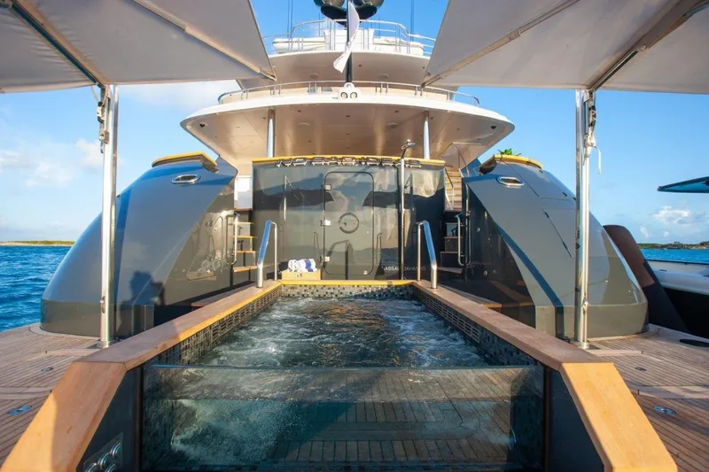 Slide: The Image of Luxurious Trinity Yachts Trinity 160, 2000 model, featuring a sleek deck and pool. - 5