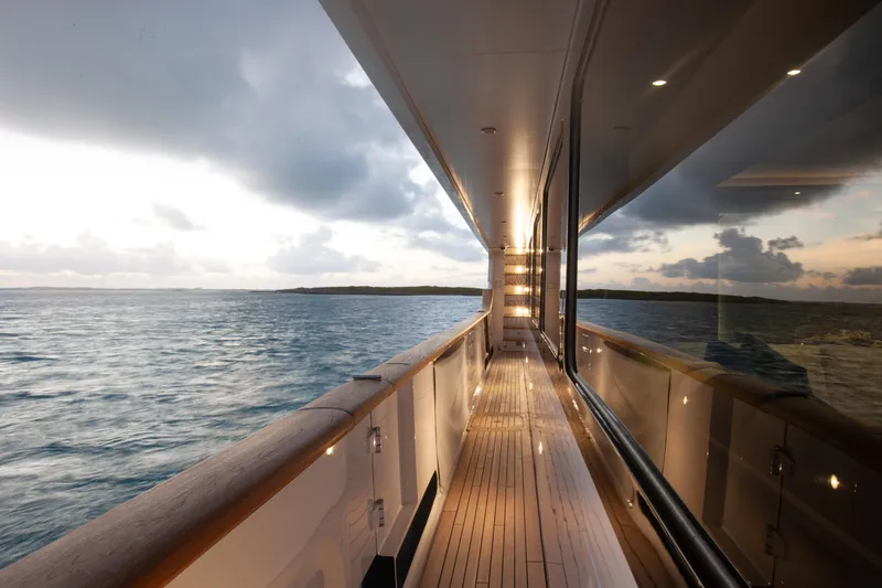Slide: The Image of Luxurious Trinity Yachts Trinity 160, 2000 model, with ocean view at sunset. - 7