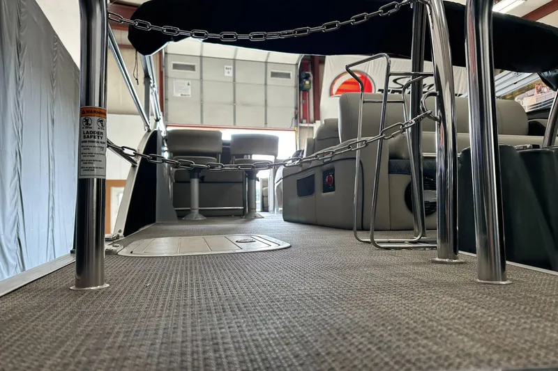 Slide: The Image of 2020 Barletta L25UE pontoon interior with safety chains and seating. - 10