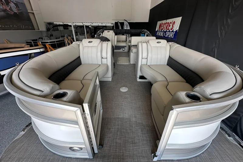 Slide: The Image of 2020 Barletta L25UE pontoon boat interior with luxurious seating and cup holders. - 13