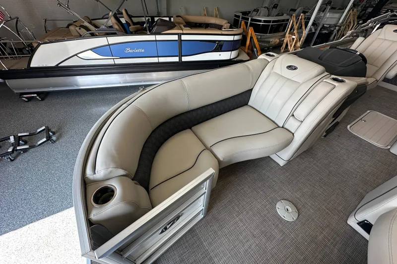 Slide: The Image of 2020 Barletta L25UE pontoon boat interior with luxurious seating and helm, displayed at Westre's Marine & Sport. - 14