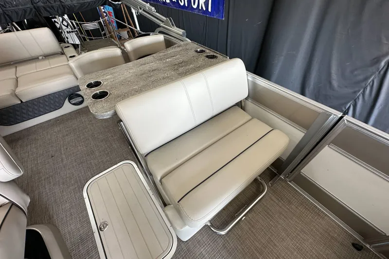 Slide: The Image of 2020 Barletta L25UE boat interior with steering wheel and seating area. - 17