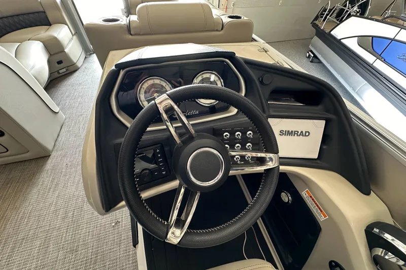 Slide: The Image of 2020 Barletta L25UE boat interior with storage cabinet and seating area. - 20