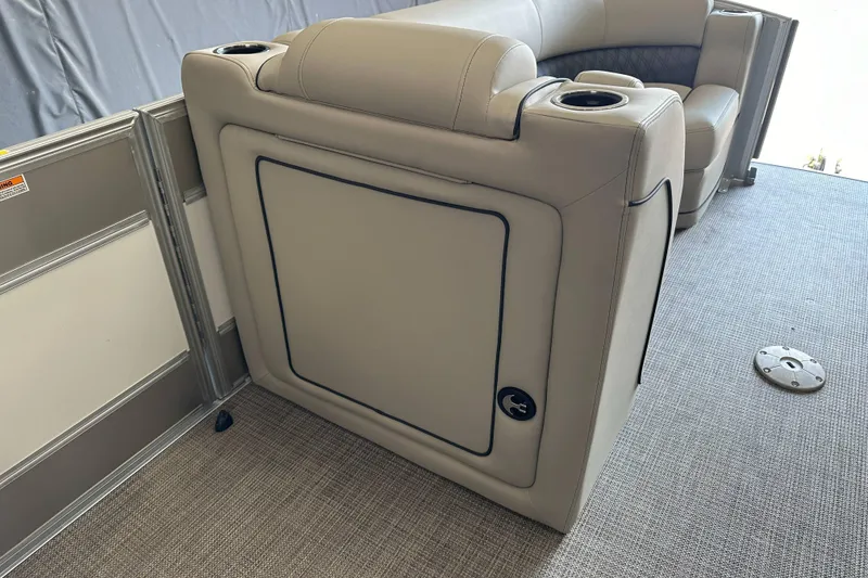 Slide: The Image of 2020 Barletta L25UE pontoon boat interior with steering console and seating. - 25