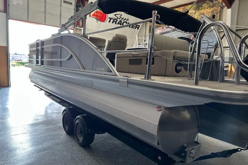 Slide: The Image of 2020 Barletta L25UE pontoon boat with powerful outboard motor in showroom. - 8