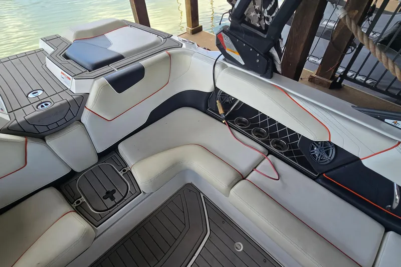 Slide: The Image of Interior of a 2018 Natique GS20 boat with white and black seating. - 10