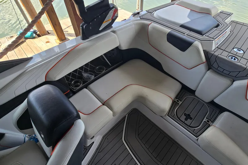 Slide: The Image of Interior of a 2018 Natique GS20 boat with sleek seating and modern design. - 11