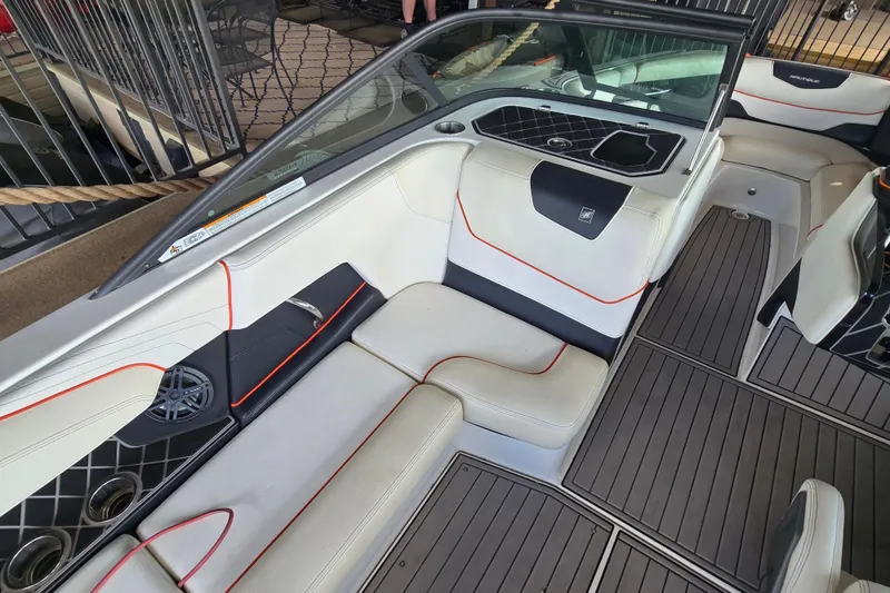 Slide: The Image of Interior of a 2018 Natique GS20 boat with modern seating and steering. - 12