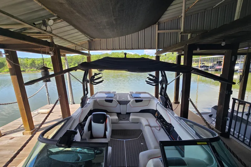 Slide: The Image of Interior of a 2018 Natique GS20 boat with modern steering and seating. - 16