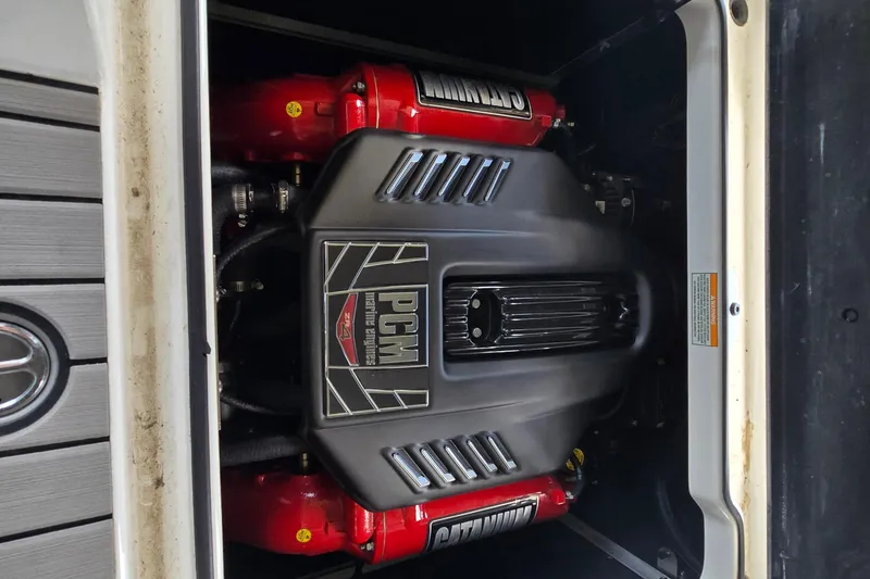 Slide: The Image of Open storage compartment in 2018 Natique GS20 boat, showing engine and ropes. - 20