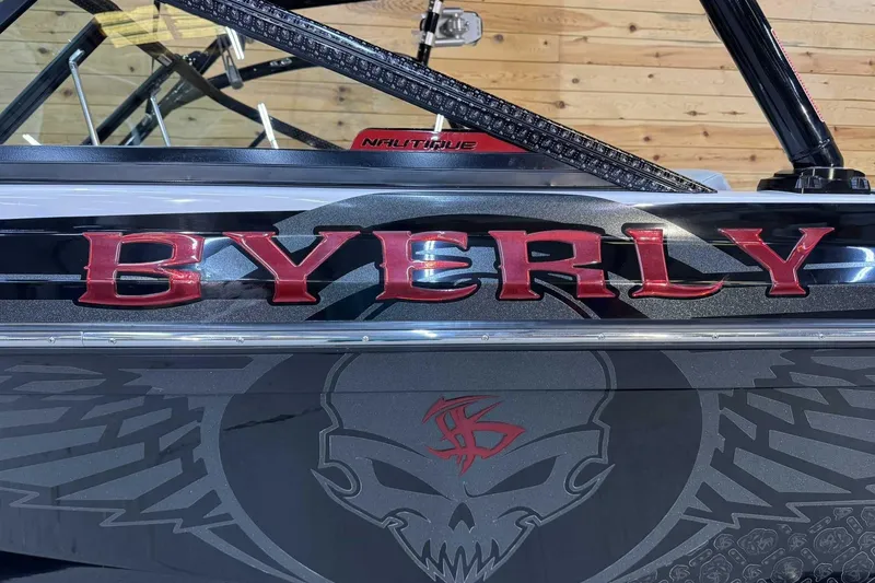 Slide: The Image of 2009 Nautique Super Air Nautique 210 Byerly boat with custom graphics and bold lettering. - 5