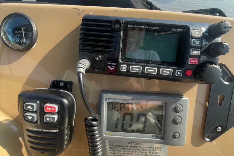 Slide: The Image of Control panel of a 2002 Carver 346 Aft Cabin with radio and depth gauge. - 10