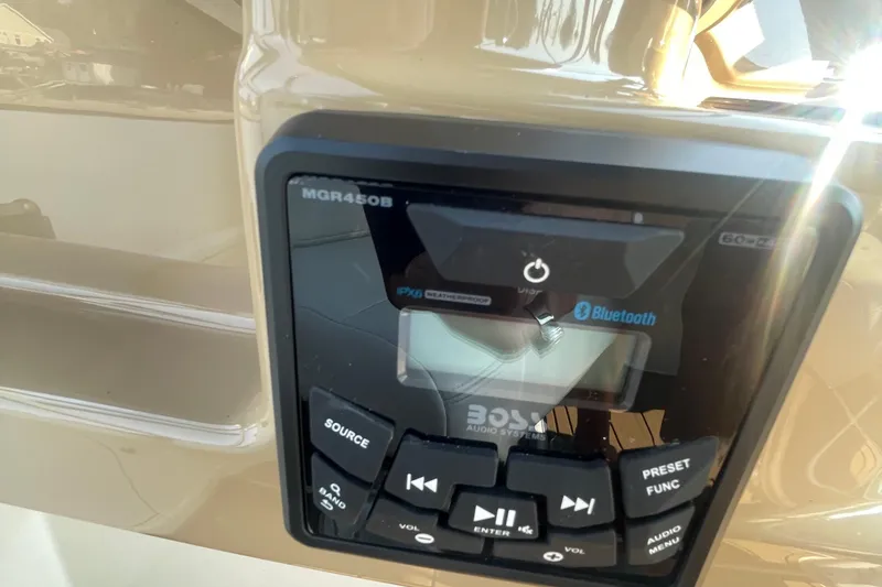 Slide: The Image of Close-up of a Boss MGR450B audio system with Bluetooth on a 2002 Carver 346 Aft Cabin. - 13