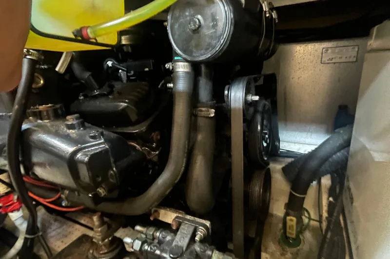 Slide: The Image of Engine compartment of a 2002 Carver 346 Aft Cabin boat, showing hoses and components. - 26