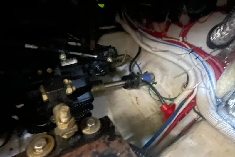 Slide: The Image of Engine compartment of 2002 Carver 346 Aft Cabin with visible wiring and components. - 27