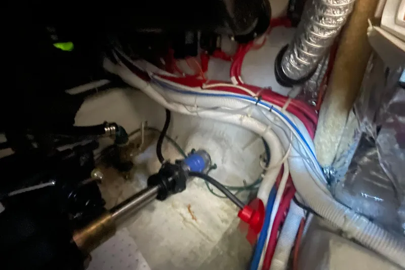 Slide: The Image of Engine room of a 2002 Carver 346 Aft Cabin with visible wiring and components. - 30