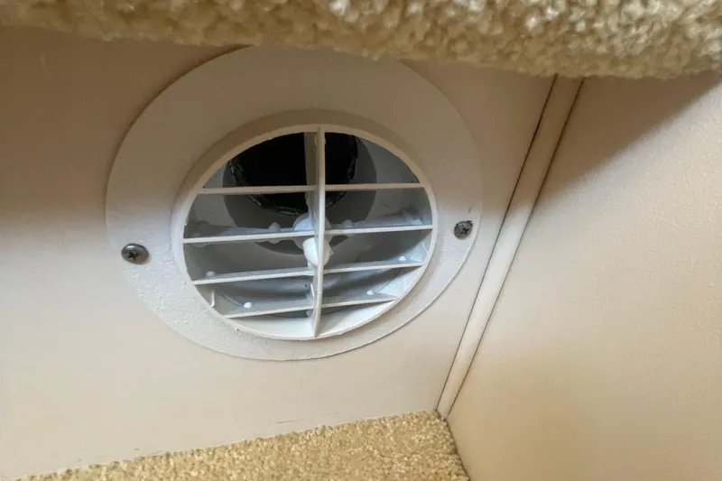Slide: The Image of Ventilation duct inside 2002 Carver 346 Aft Cabin, featuring a circular white grille. - 33