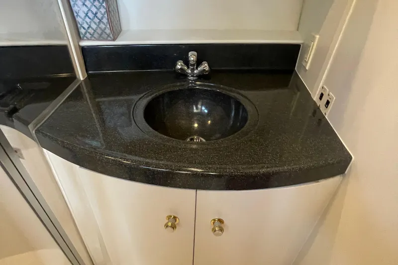 Slide: The Image of Black countertop sink in 2002 Carver 346 Aft Cabin yacht bathroom. - 37