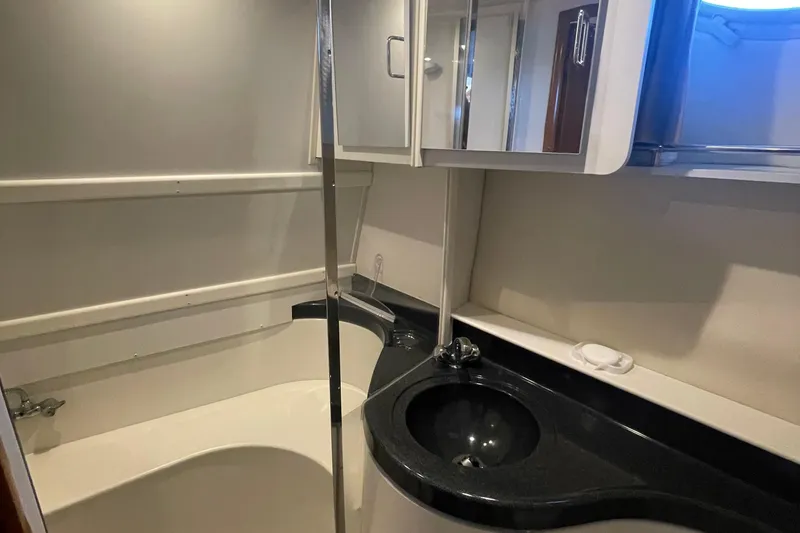 Slide: The Image of Bathroom interior of 2002 Carver 346 Aft Cabin yacht with sink and shower. - 48