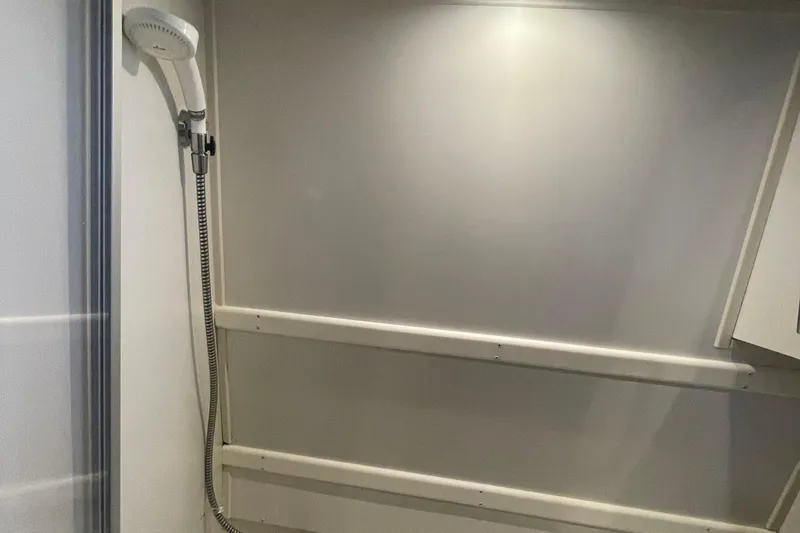 Slide: The Image of Shower area in 2002 Carver 346 Aft Cabin yacht, featuring a handheld showerhead. - 49