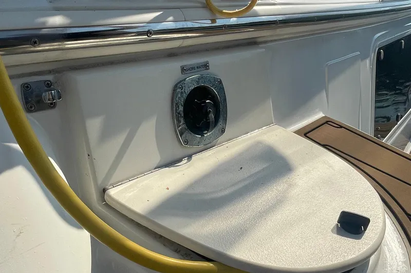 Slide: The Image of 2002 Carver 346 Aft Cabin boat with shore water connection and yellow hose. - 53