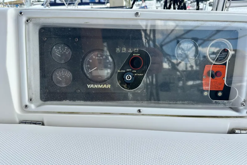 Slide: The Image of Control panel of a 2006 Hunter 41 Deck Salon sailboat with Yanmar engine gauges. - 23