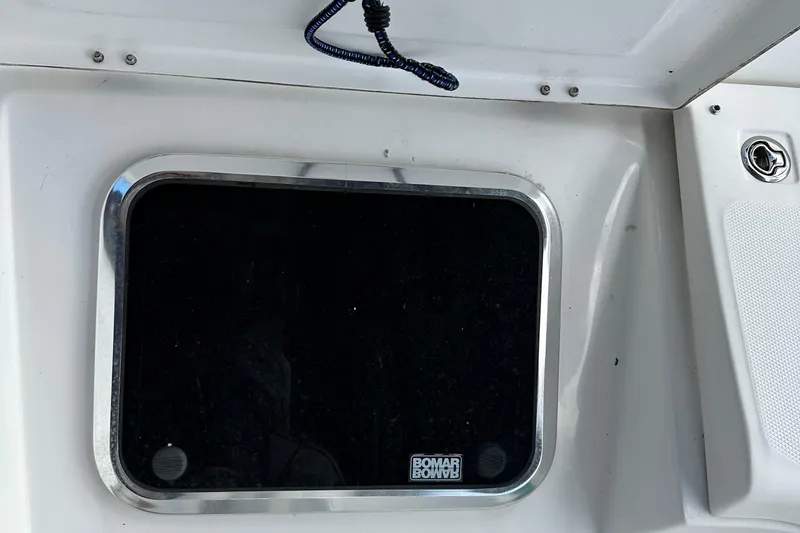 Slide: The Image of Boat window on 2006 Hunter 41 Deck Salon, featuring Bomar brand frame. - 24