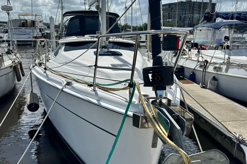 Slide: The Image of 2006 Hunter 41 Deck Salon sailboat docked at marina, featuring sleek design and modern amenities. - 4