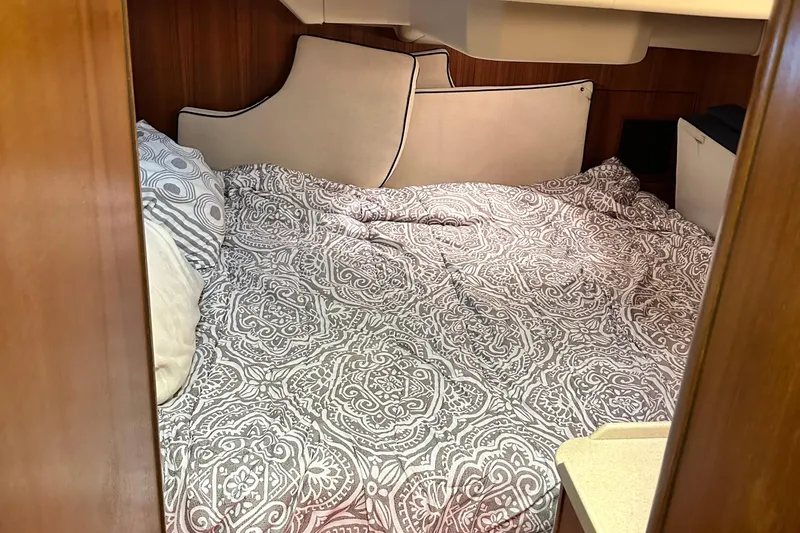 Slide: The Image of Cozy cabin interior of 2006 Hunter 41 Deck Salon with patterned bedding. - 40