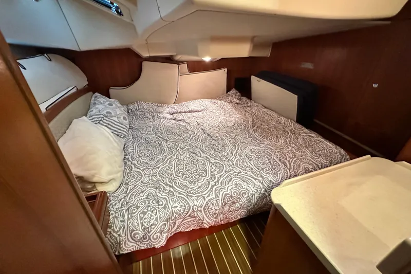 Slide: The Image of Cozy cabin interior of 2006 Hunter 41 Deck Salon with patterned bedding. - 41