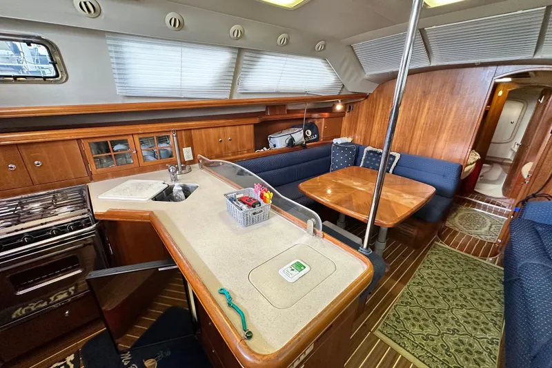 Slide: The Image of Interior of 2006 Hunter 41 Deck Salon yacht with kitchen and dining area. - 47