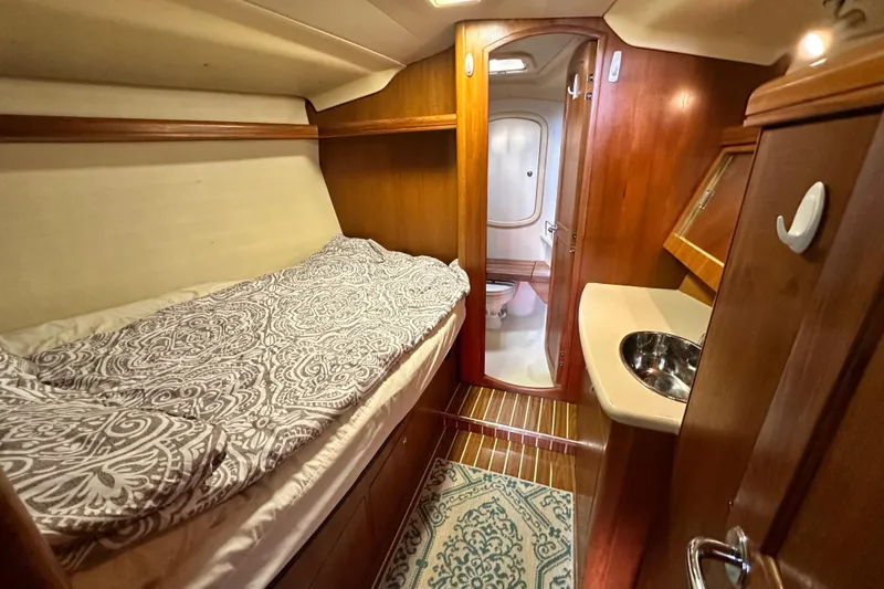 Slide: The Image of Interior of 2006 Hunter 41 Deck Salon yacht cabin with bed and sink. - 51