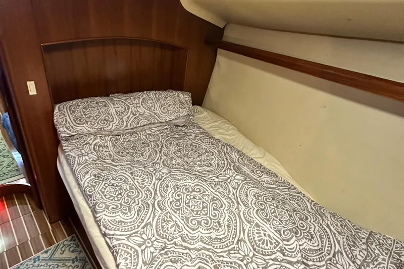 Slide: The Image of Cozy bedroom in 2006 Hunter 41 Deck Salon yacht with patterned bedding. - 57