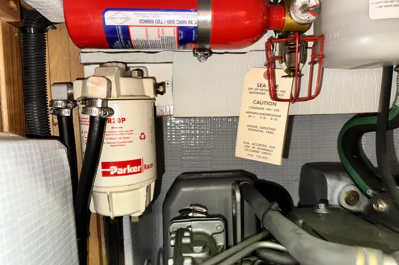 Slide: The Image of Engine compartment of 2006 Hunter 41 Deck Salon with Parker Racor filter and fire extinguisher. - 68