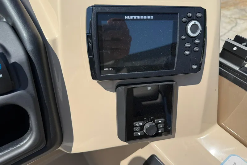 Slide: The Image of Control panel of 2025 Bentley Pontoons Legacy 243 Navigator with Humminbird and JBL systems. - 14