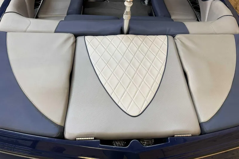 Slide: The Image of 2011 MasterCraft X2 boat interior with diamond-stitched upholstery and sleek design. - 5