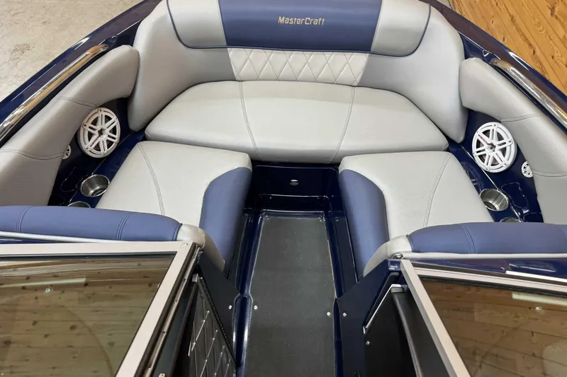 Slide: The Image of Interior of 2011 MasterCraft X2 boat with blue and gray seating. - 8