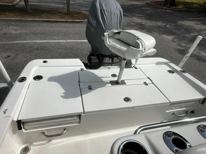 Slide: The Image of 2018 Triton 220LTS boat deck with seating and Yamaha engine cover. - 6