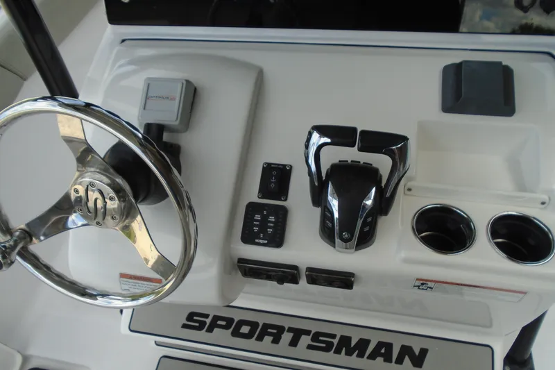 Slide: The Image of 2021 Sportsman Open 252 Center Console dashboard with steering wheel and controls. - 10